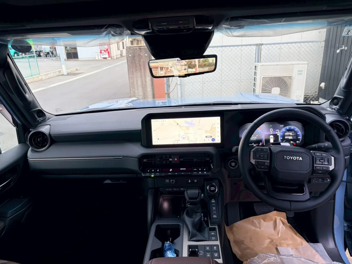 Right-hand-drive cockpit of the blue 2026 Land Cruiser 250 ZX