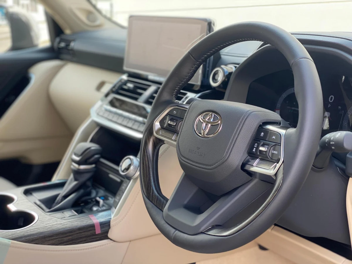 Right-hand-drive cockpit of the Bronze Land Cruiser 300 ZX