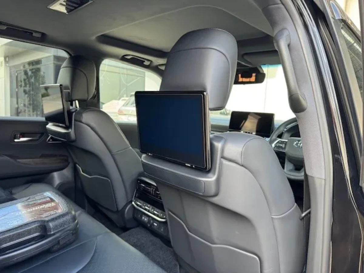 Rear passenger cabin with entertainment displays in the Sahara LC300