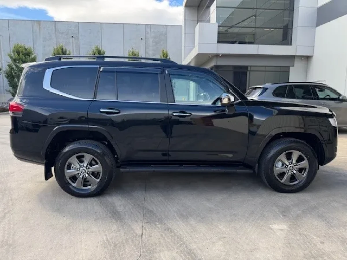 Side profile of the dark 2026 Land Cruiser Sahara LC300