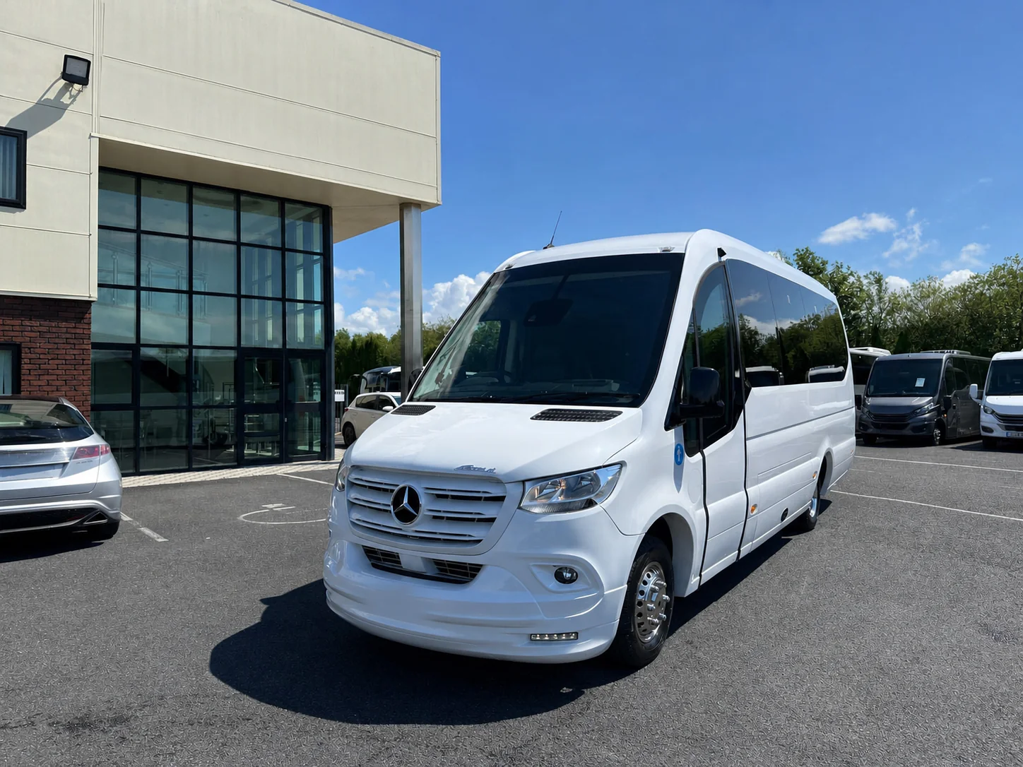 White Mercedes-Benz Sprinter Ferqui Sunset midi coach exterior