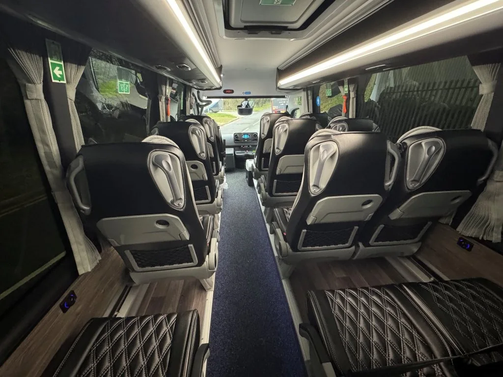 Wide aisle and passenger seating inside the Ferqui Sunset