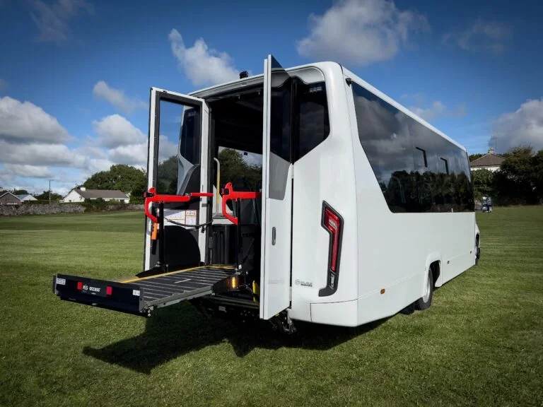 Rear PLS wheelchair lift deployed on the electric minibus