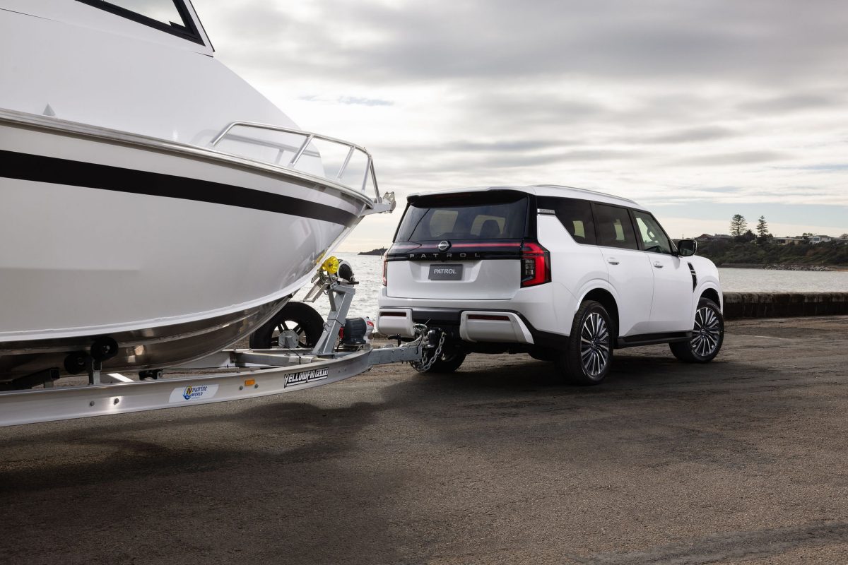 White all-new Nissan Patrol towing a boat in official Australian imagery